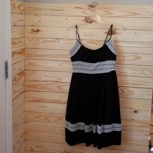 Black silk dress with white lace trim